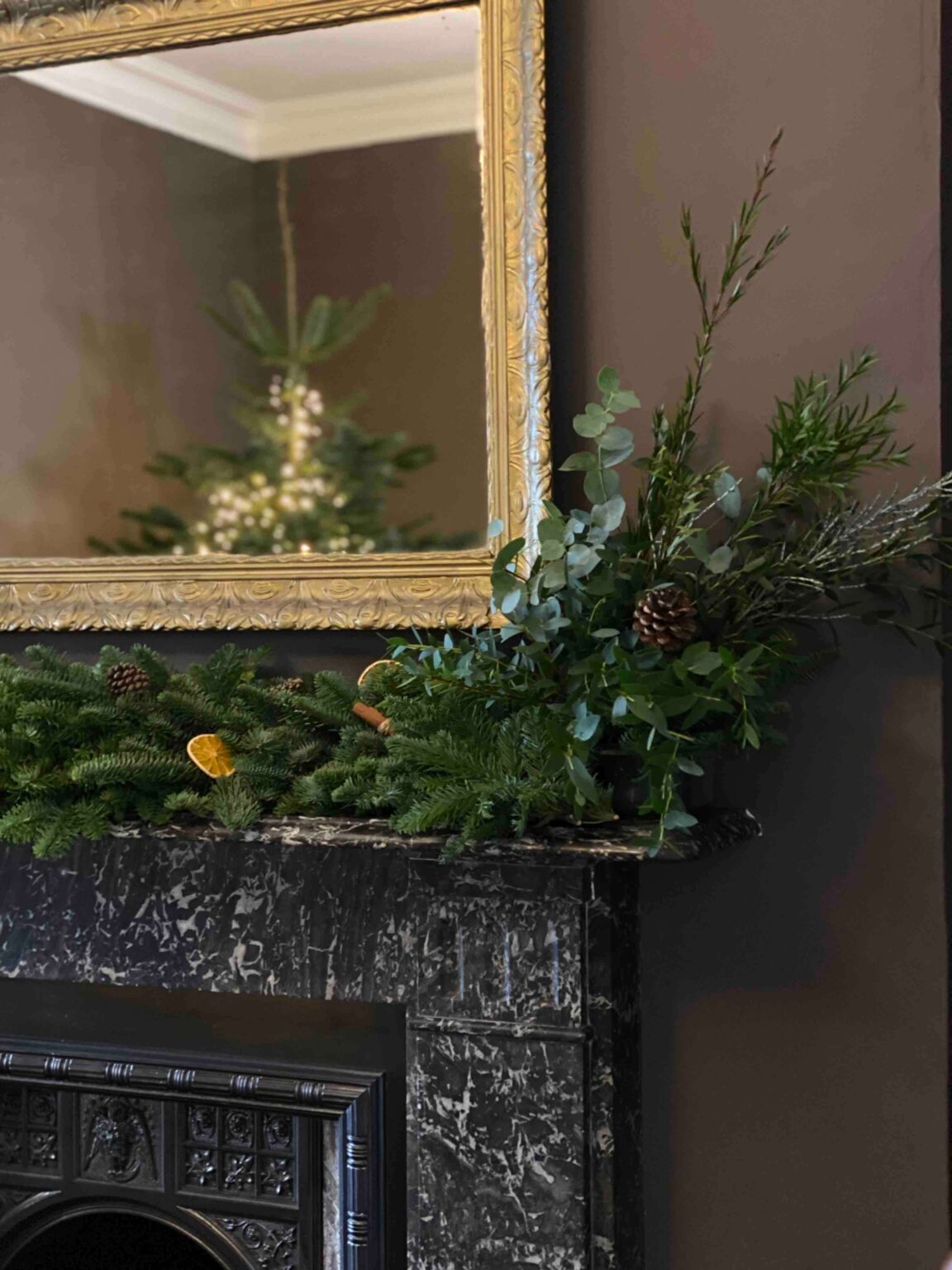 Pines and Co Garland: Beautiful holiday garland made with pine branches, ornaments, and eucalyptus